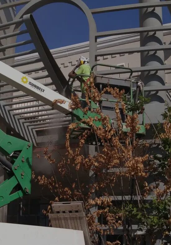 Workers install metal framework on a building under construction.
